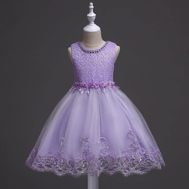DreamHigh Flower Girl Dress for 3-10 Years Old Girls by AURORE LUXURE, showcasing an elegant purple floral-embroidered dress with intricate pearl details and a fluffy tulle skirt.