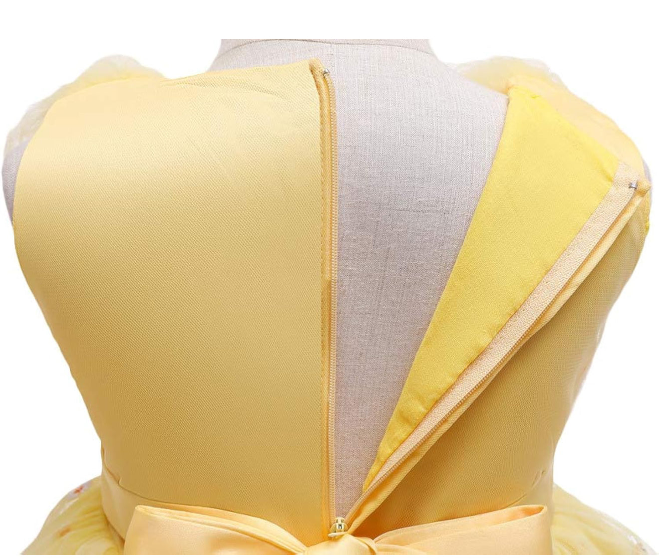 Girl smiling in a yellow dress with flowers, included in the Baby Girls Dresses Summer collection.