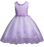 DreamHigh Flower Girl Dress for 3-10 Years Old Girls by AURORE LUXURE, featuring a beautiful purple floral dress with intricate pearl embroidery and a stylish tulle skirt.